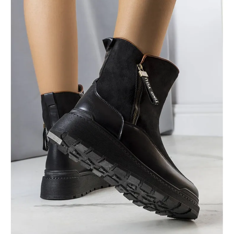 Black insulated boots on the Niklas platform