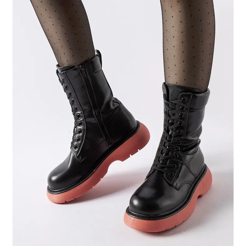 Black insulated boots with a pink Beata sole